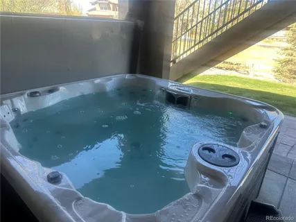 a bathroom with a sink a toilet a mirror and shower