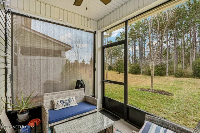 a view of a kitchen area with furniture and wooden floor
