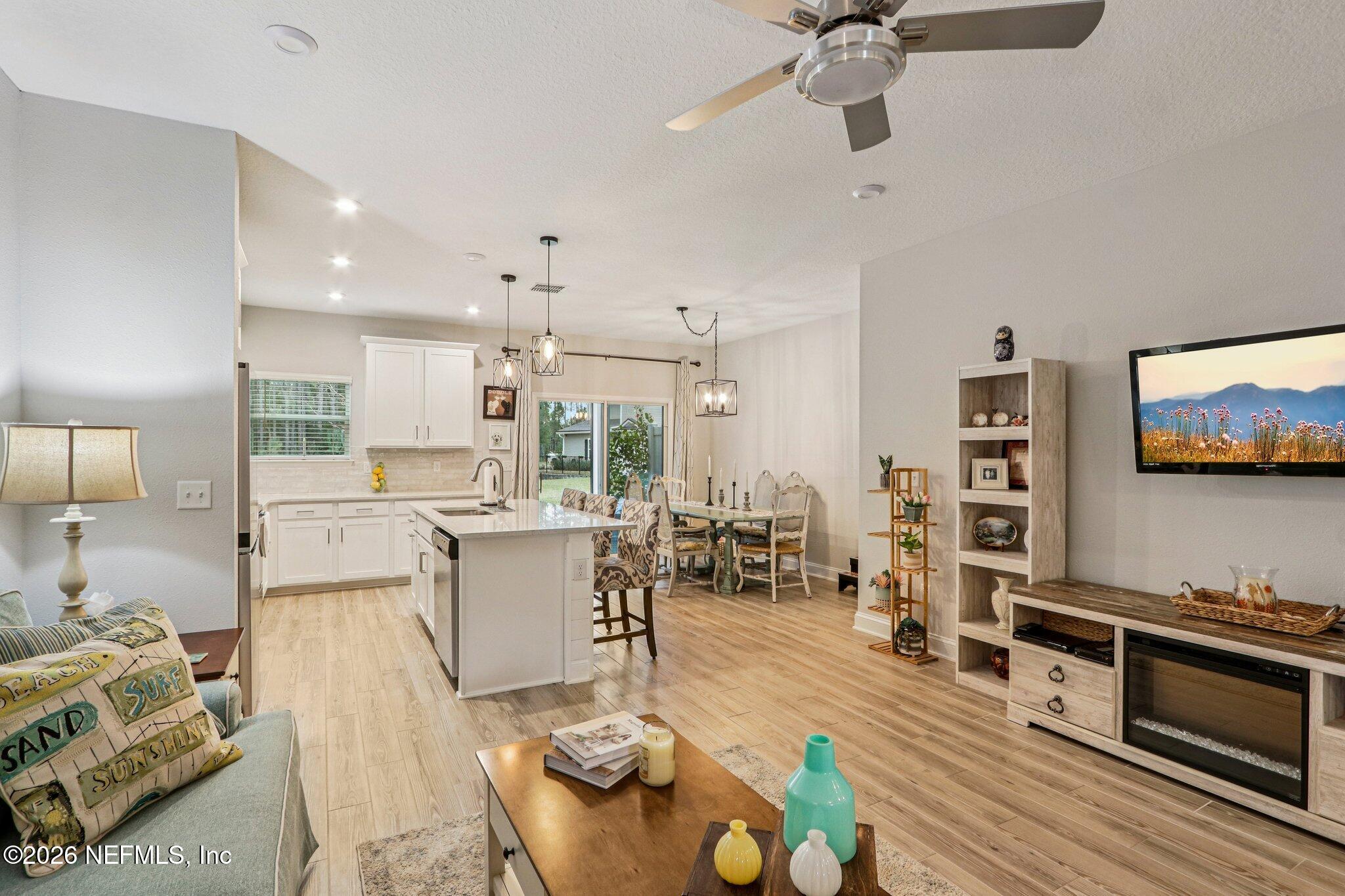 12068 Calvesta Street Jacksonville, FL 32256 - Photo 21 of 100 a living room with furniture and a flat screen tv