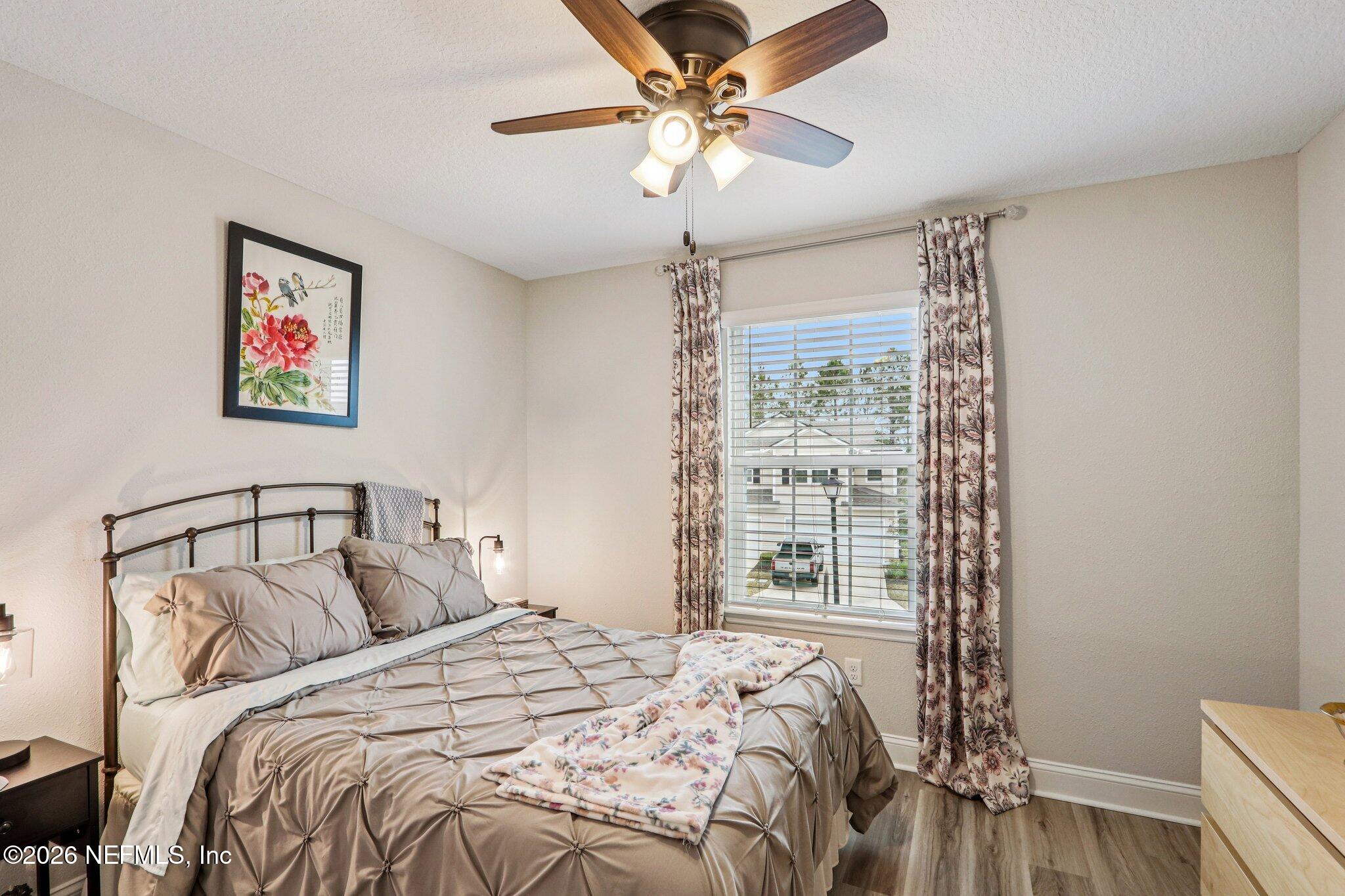 12068 Calvesta Street Jacksonville, FL 32256 - Photo 35 of 100 a bedroom with a bed and a window