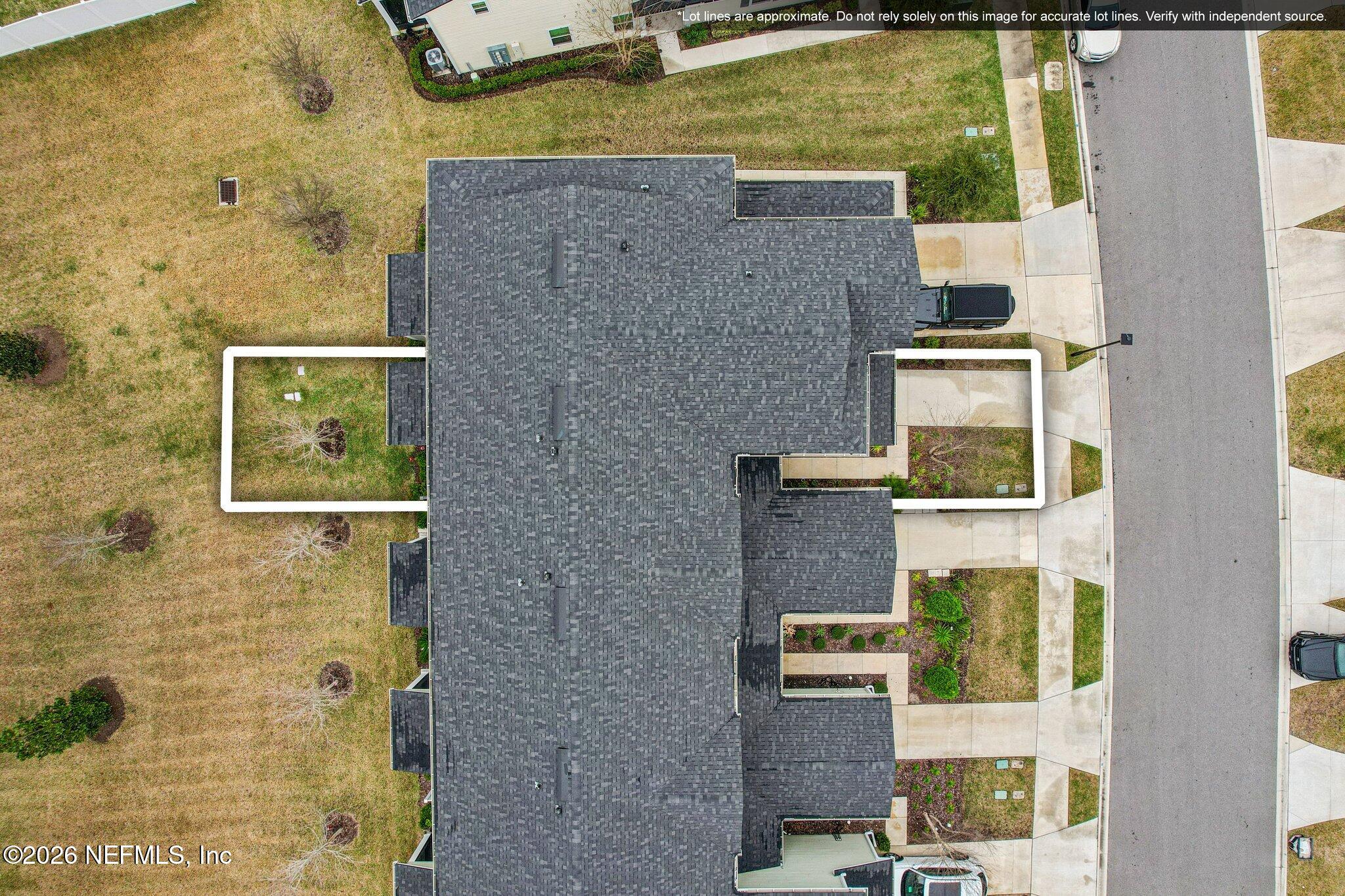 12068 Calvesta Street Jacksonville, FL 32256 - Photo 41 of 100 front view of a brick house next to a yard