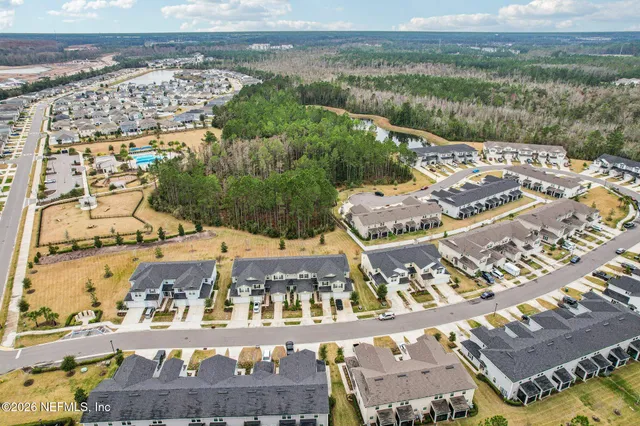 a front view of a house with a yard and street view