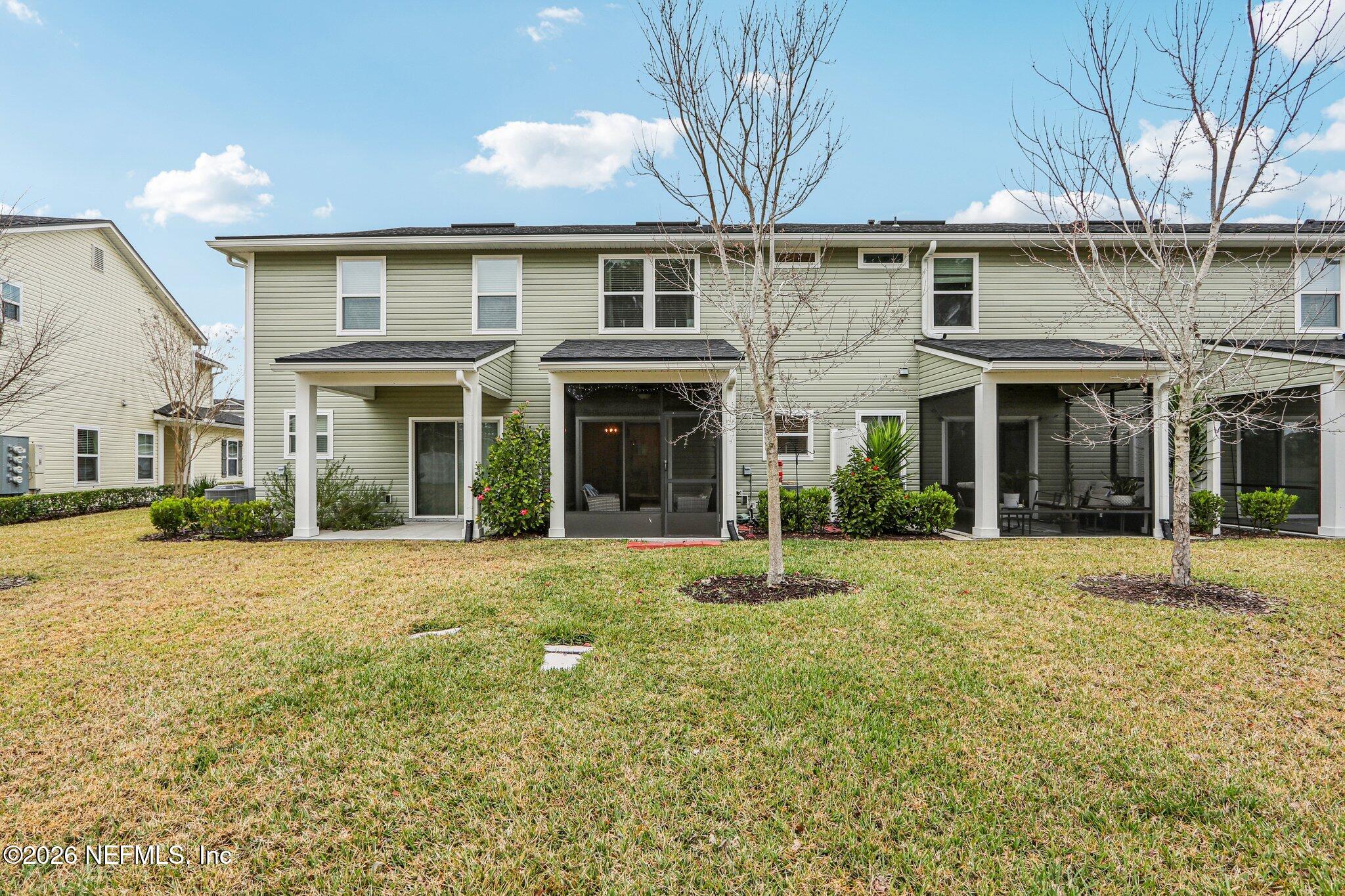 12068 Calvesta Street Jacksonville, FL 32256 - Photo 5 of 100 front view of a house with a yard