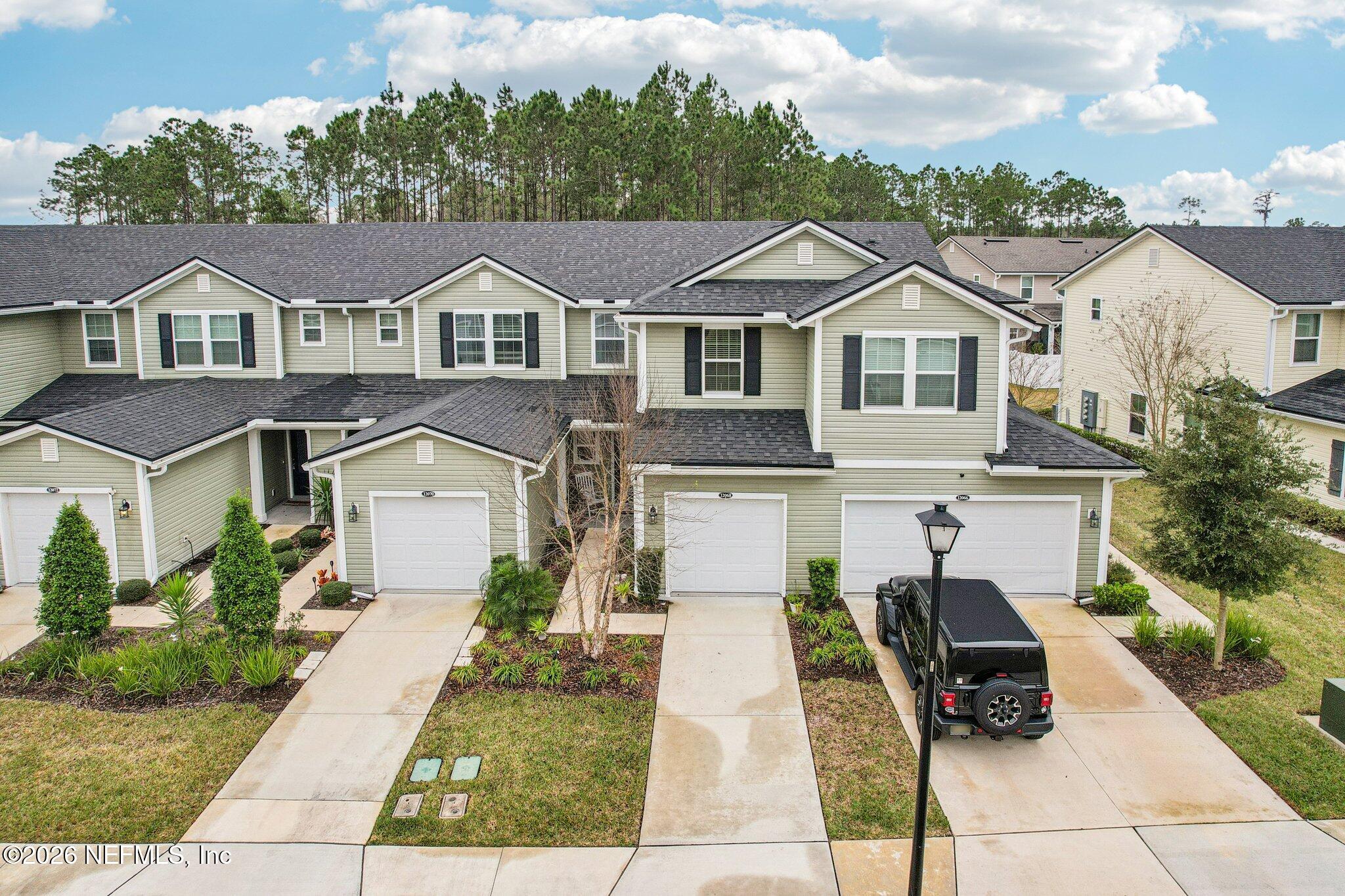 12068 Calvesta Street Jacksonville, FL 32256 - Photo 55 of 100 a front view of a house with a yard
