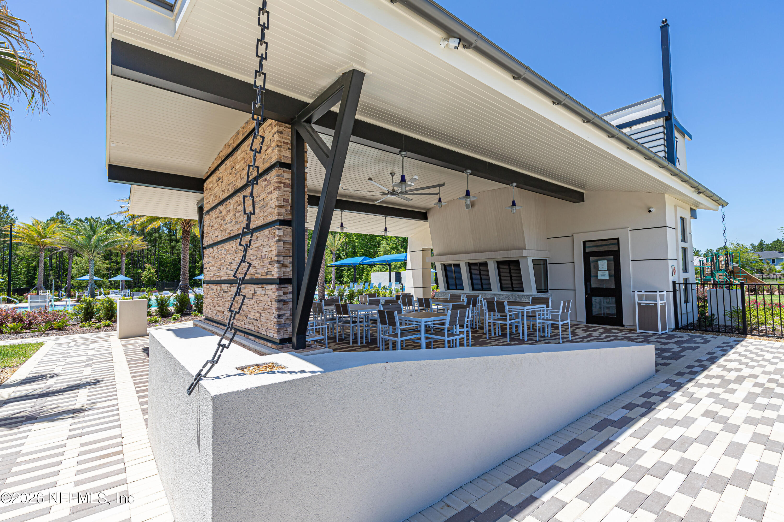 12068 Calvesta Street Jacksonville, FL 32256 - Photo 61 of 100 a view of a patio with couches table and chairs