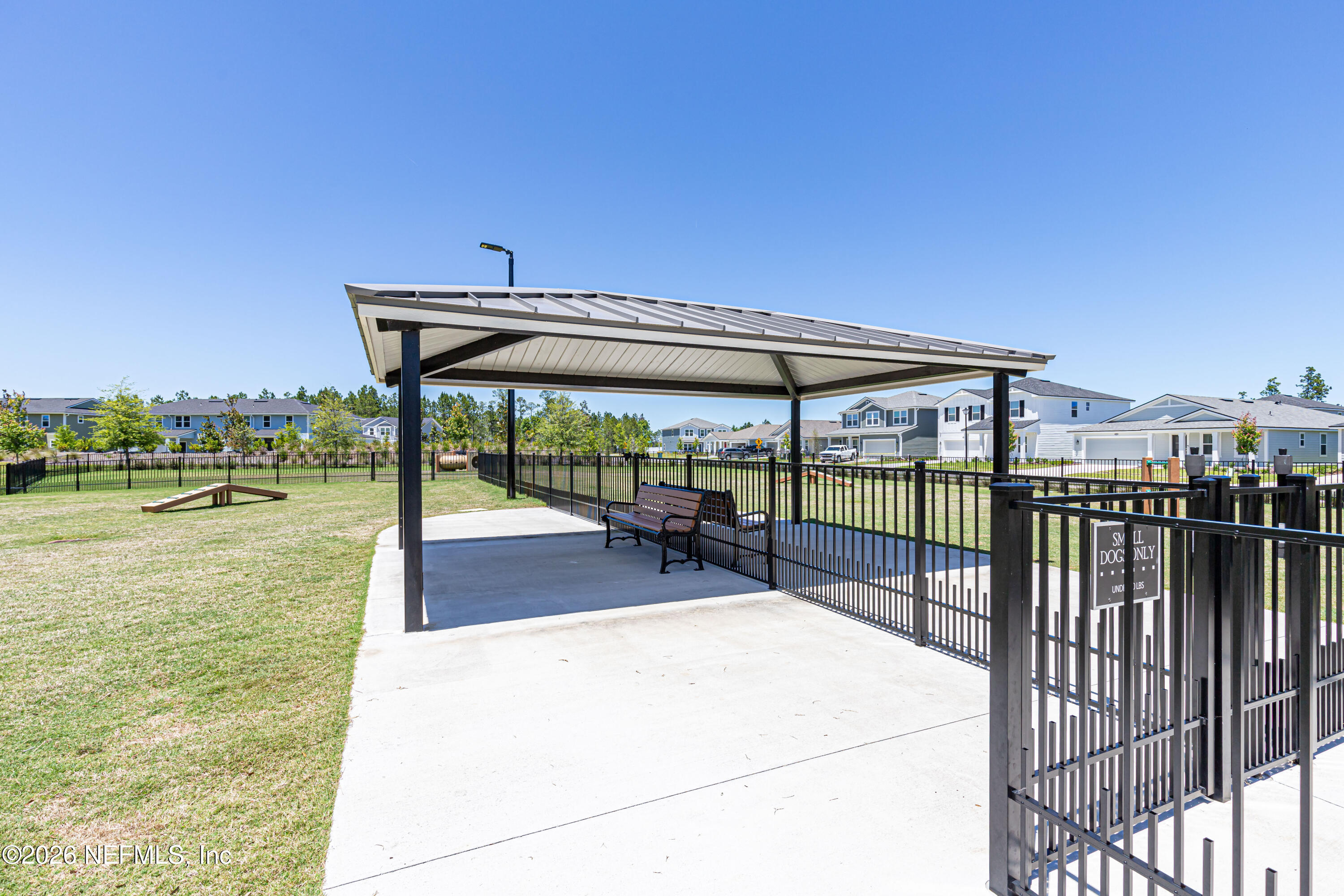 12068 Calvesta Street Jacksonville, FL 32256 - Photo 72 of 100 a view of a swimming pool with a patio