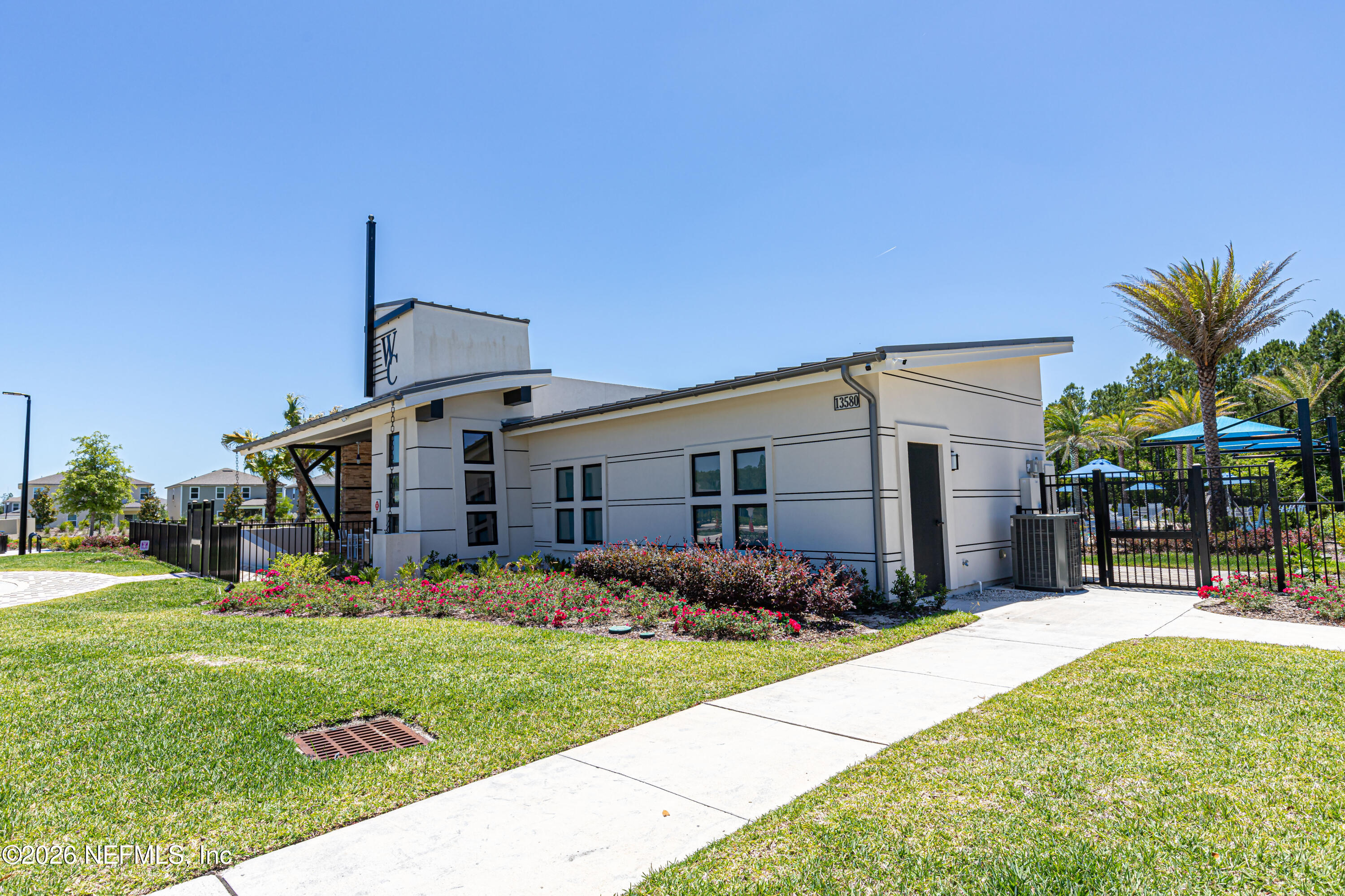 12068 Calvesta Street Jacksonville, FL 32256 - Photo 75 of 100 a front view of house with yard and green space
