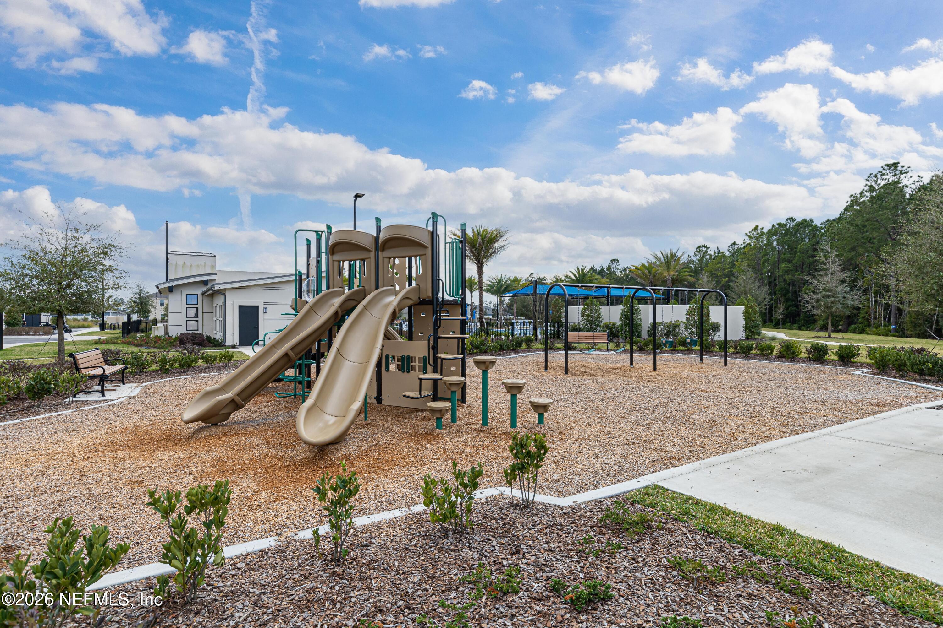12068 Calvesta Street Jacksonville, FL 32256 - Photo 78 of 100 a view of a park with swings
