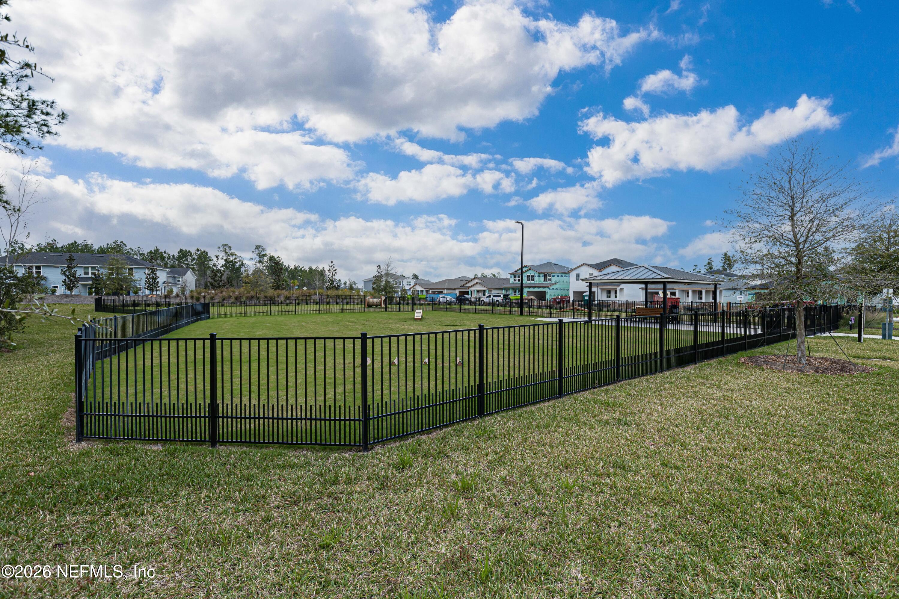12068 Calvesta Street Jacksonville, FL 32256 - Photo 79 of 100 a view of a yard and a fence