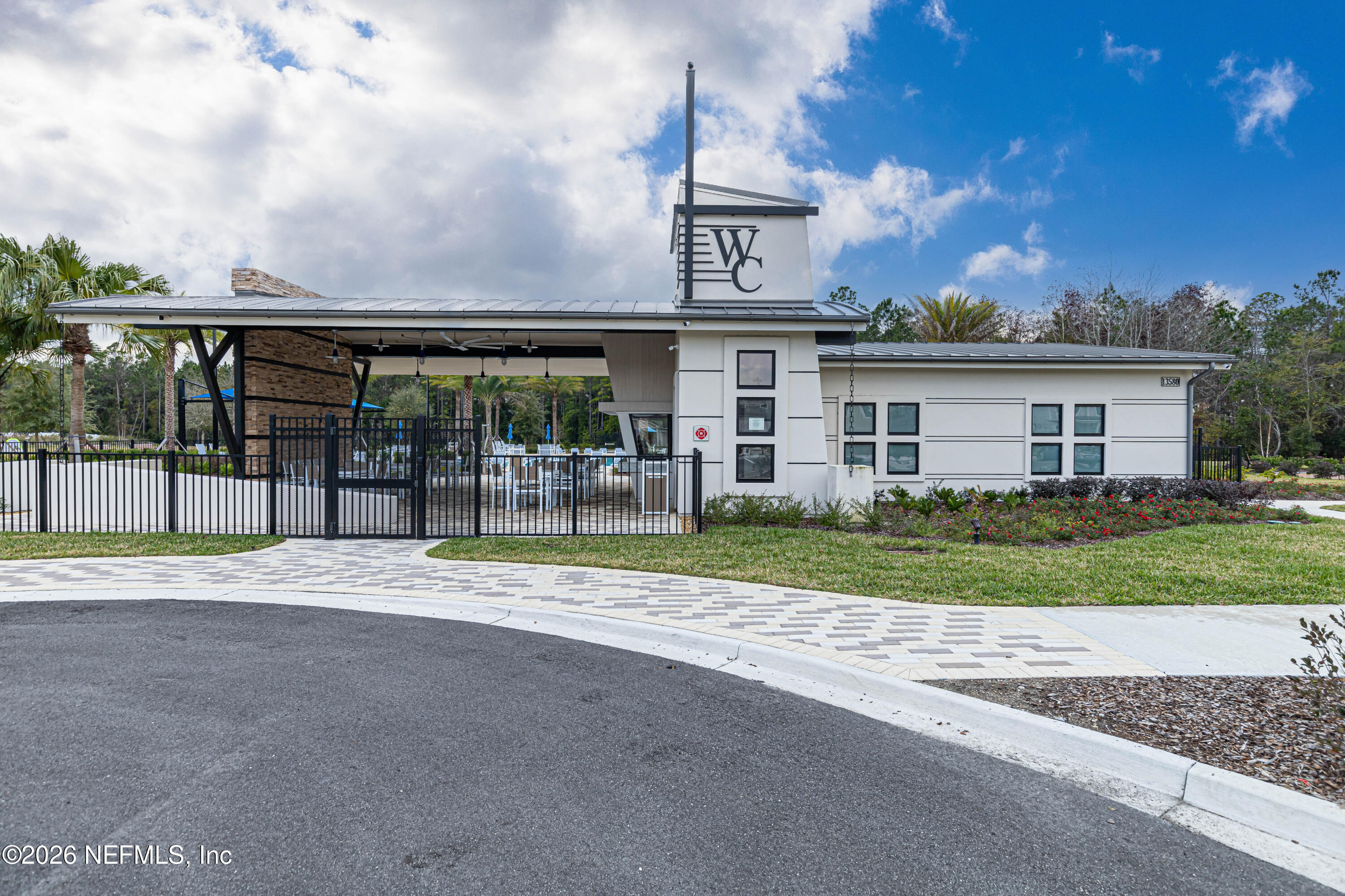 12068 Calvesta Street Jacksonville, FL 32256 - Photo 85 of 100 a view of a house with a yard and plants