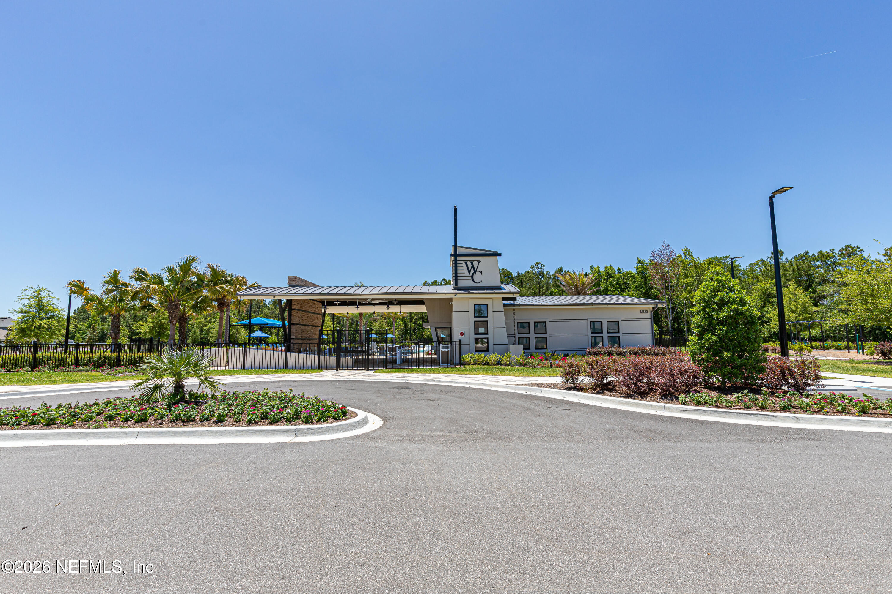 12068 Calvesta Street Jacksonville, FL 32256 - Photo 86 of 100 a front view of a house with a yard and street view