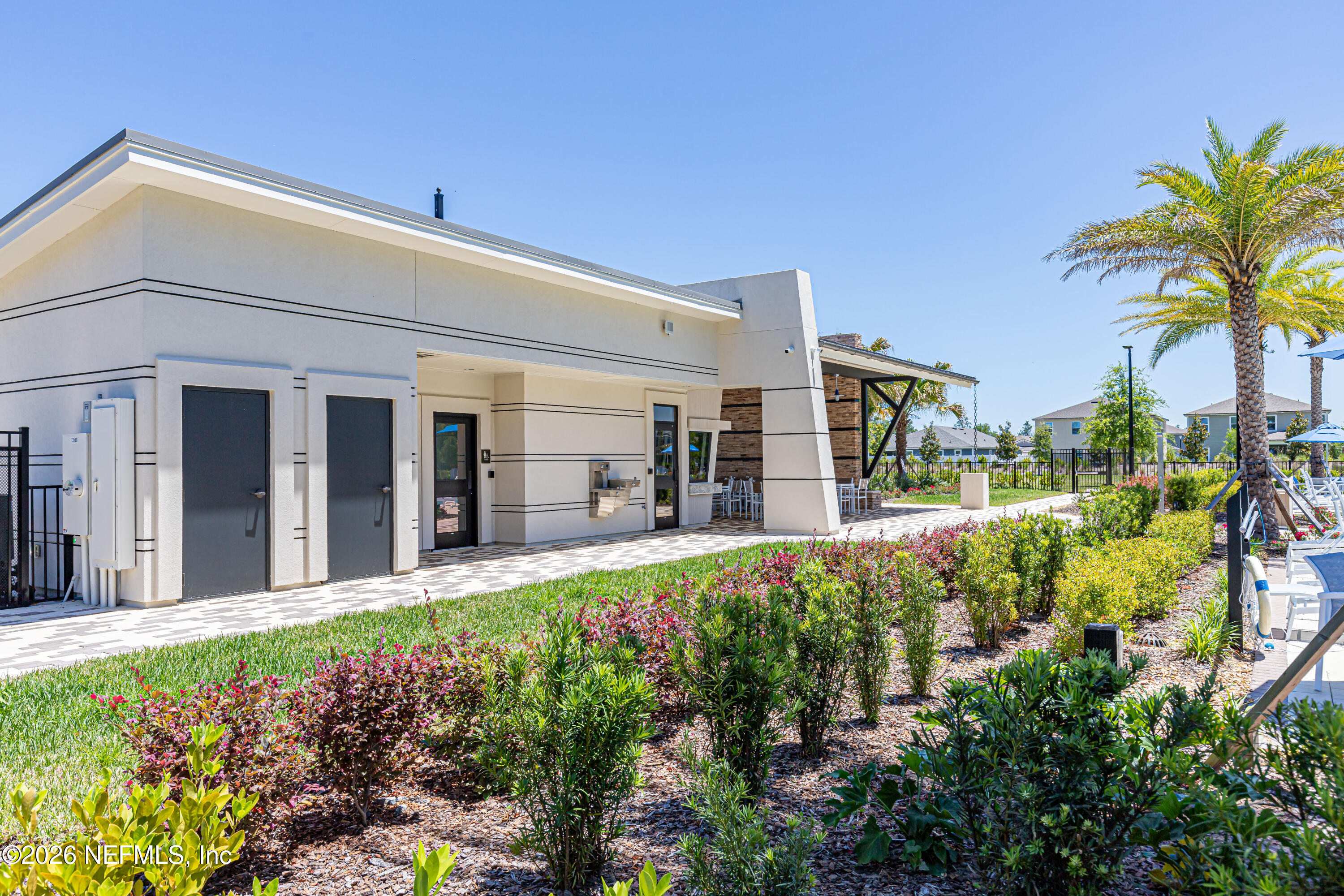 12068 Calvesta Street Jacksonville, FL 32256 - Photo 90 of 100 a front view of a house with a garden