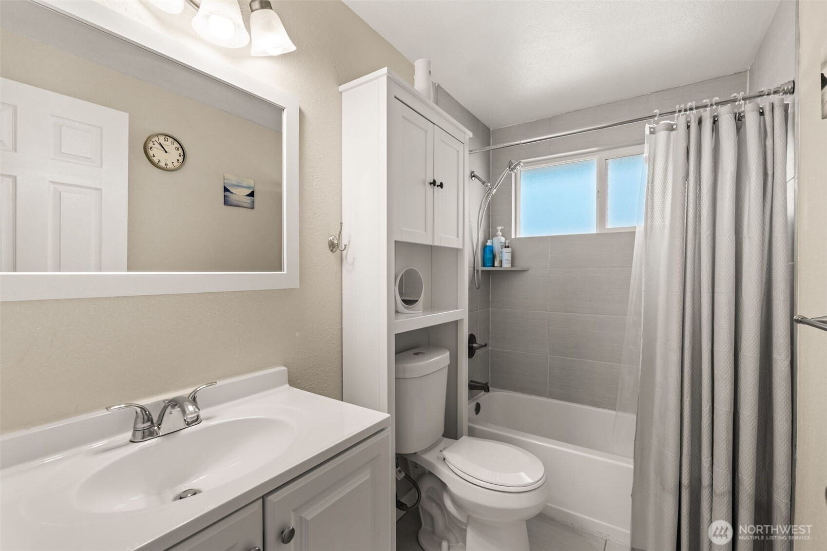 19234 121st Place Southeast Kent, WA 98031 - Photo 12 of 37 a bathroom with a sink a toilet and shower