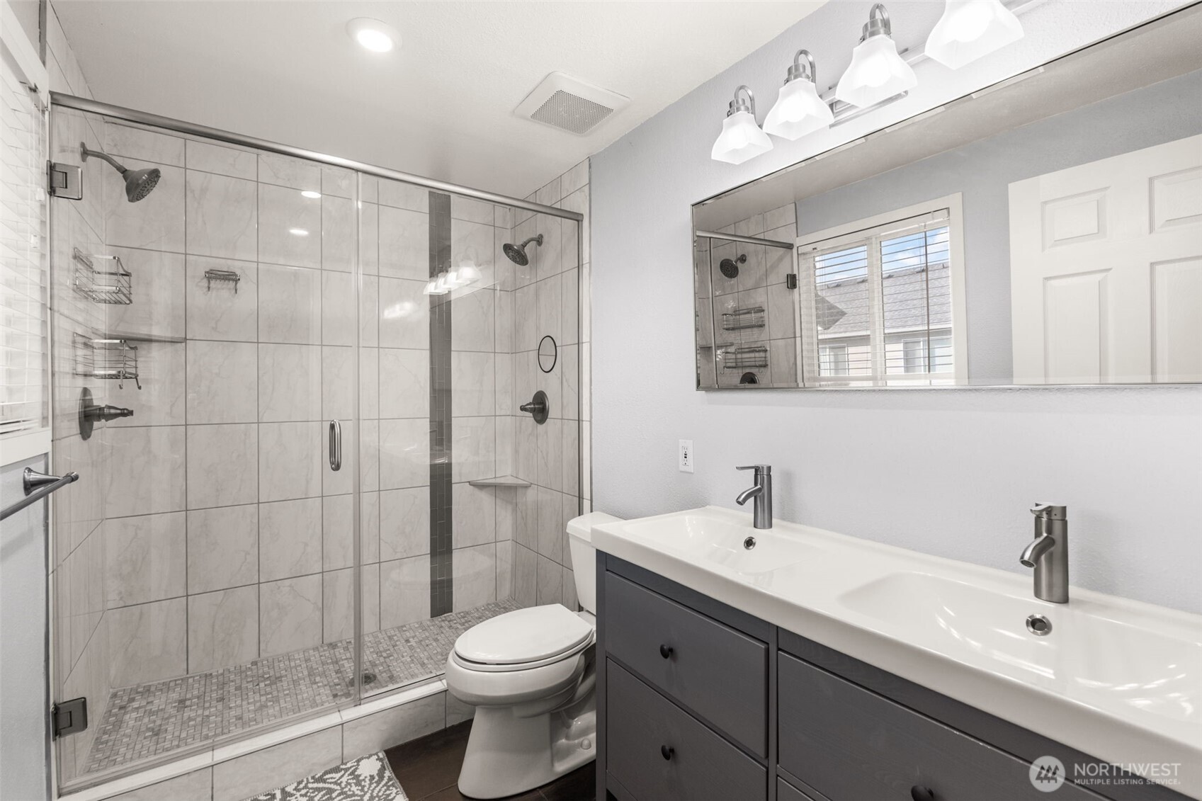19234 121st Place Southeast Kent, WA 98031 - Photo 18 of 37 a bathroom with a sink a toilet and shower