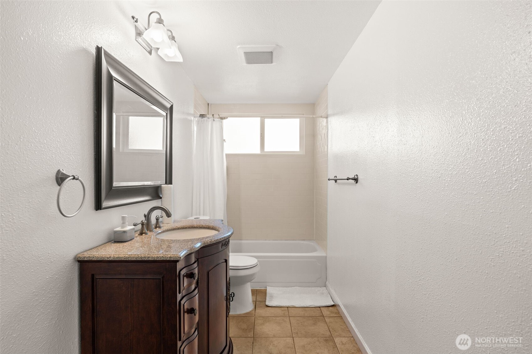 19234 121st Place Southeast Kent, WA 98031 - Photo 22 of 37 a bathroom with a sink a toilet and shower