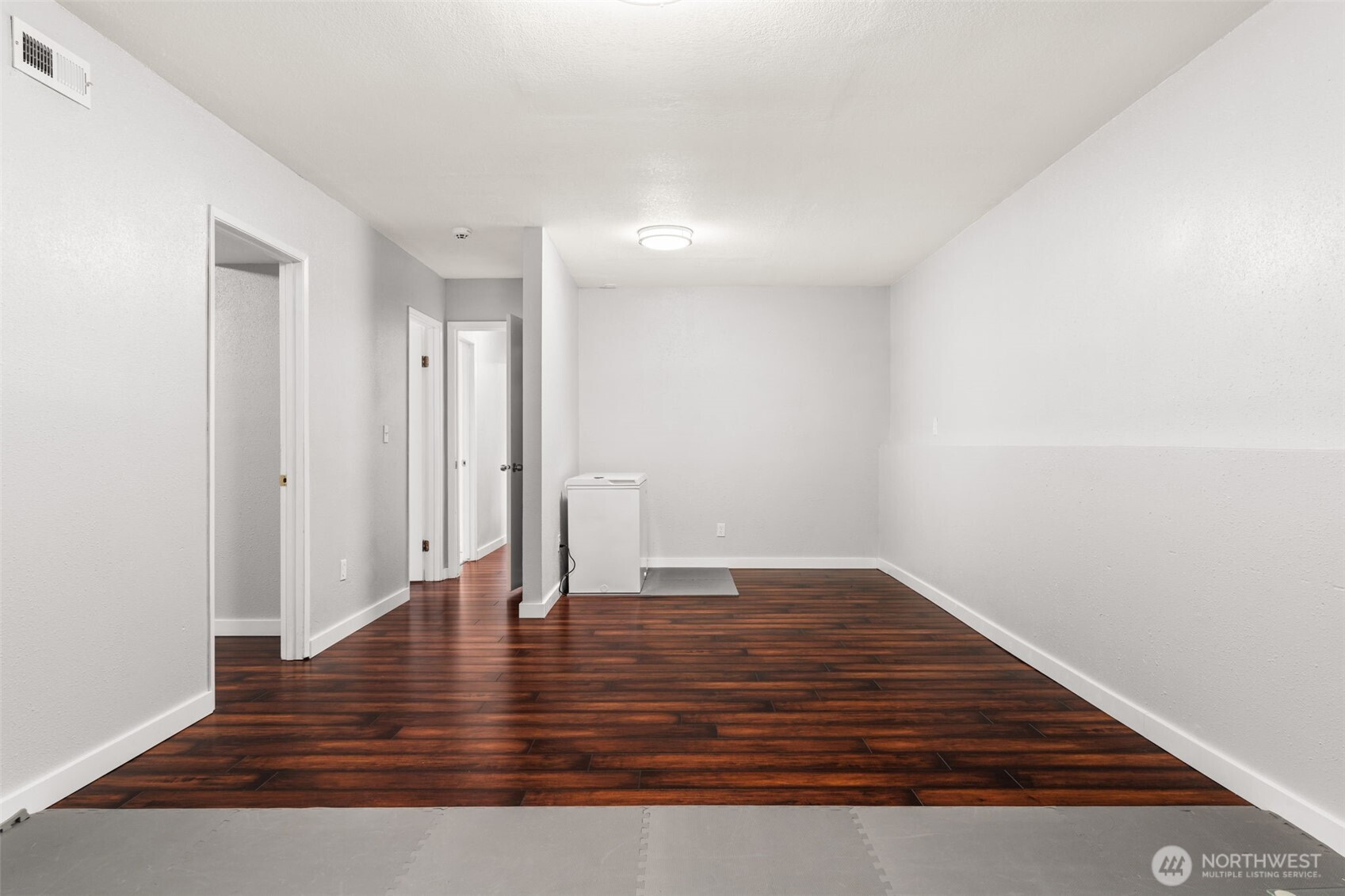 19234 121st Place Southeast Kent, WA 98031 - Photo 24 of 37 a view of an empty room with wooden floor