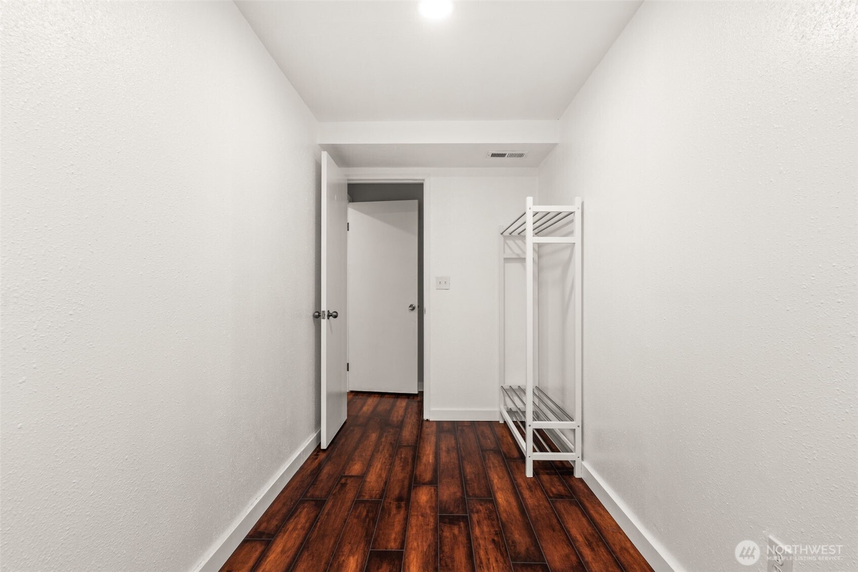 19234 121st Place Southeast Kent, WA 98031 - Photo 26 of 37 a view of a room with wooden floor and a hallway