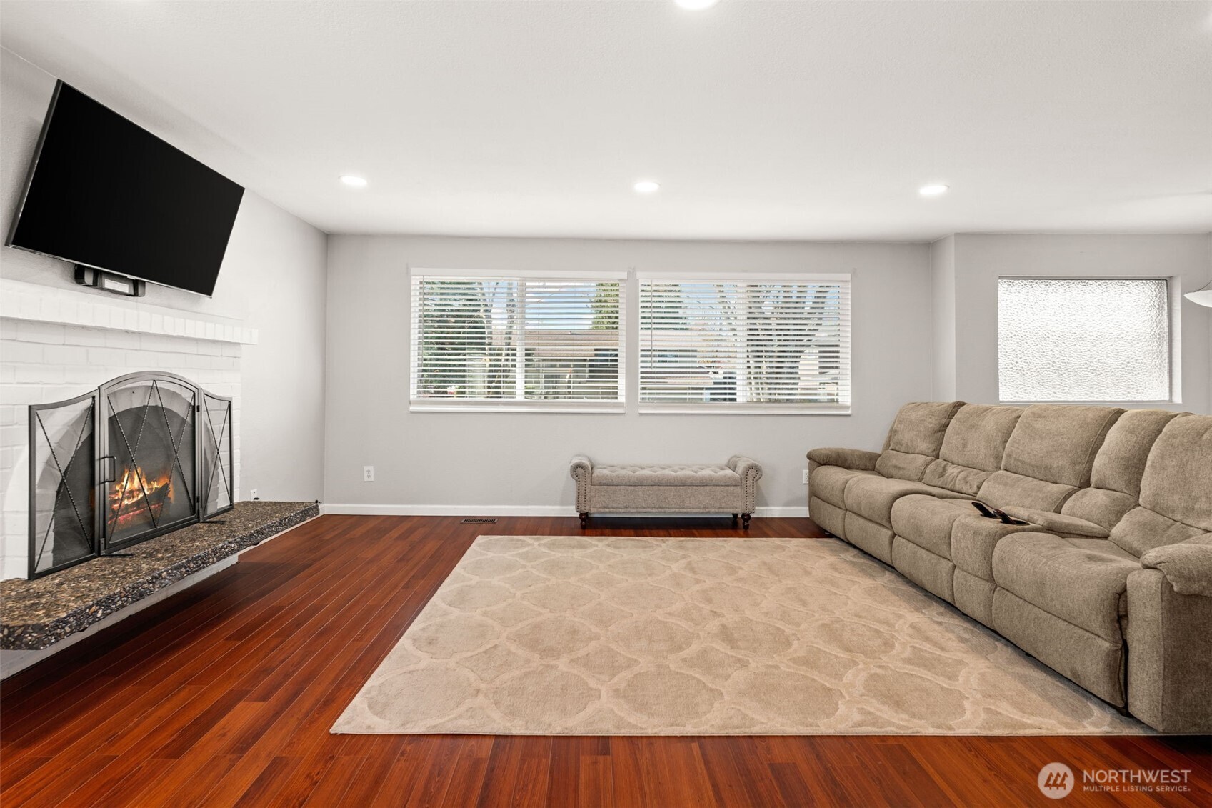 19234 121st Place Southeast Kent, WA 98031 - Photo 3 of 37 a living room with furniture and a fireplace