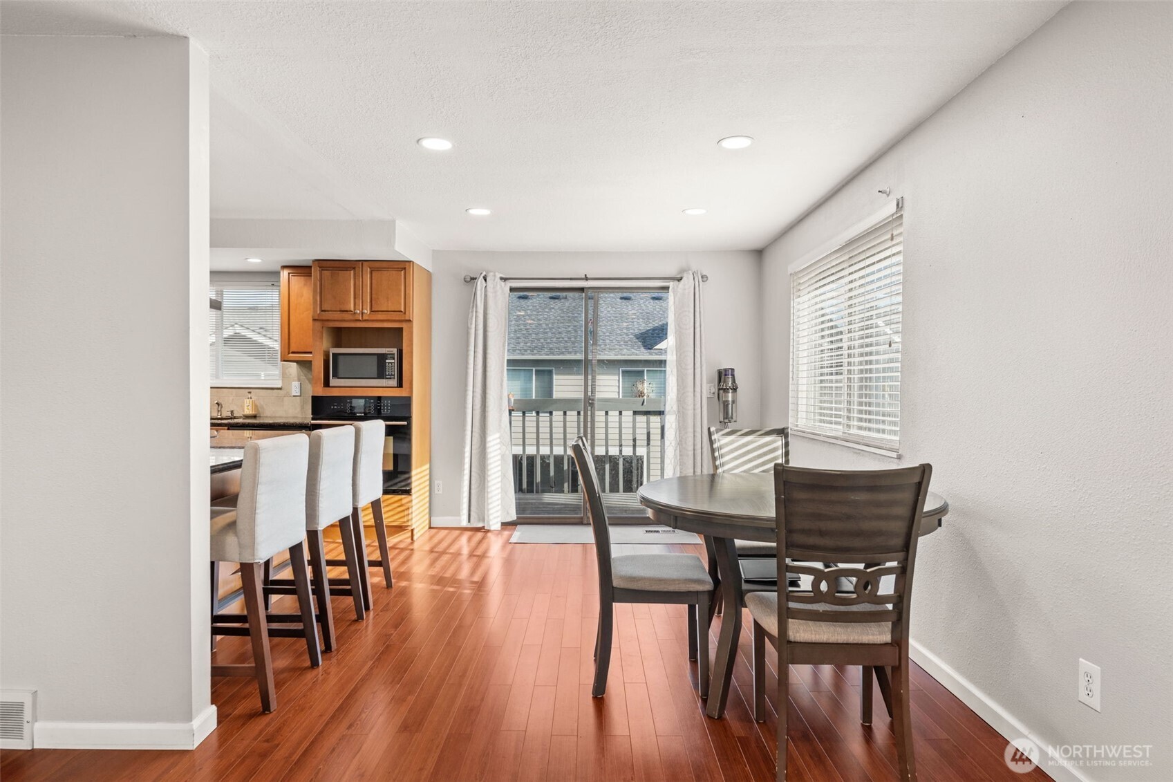 19234 121st Place Southeast Kent, WA 98031 - Photo 5 of 37 a dining room with furniture and wooden floor