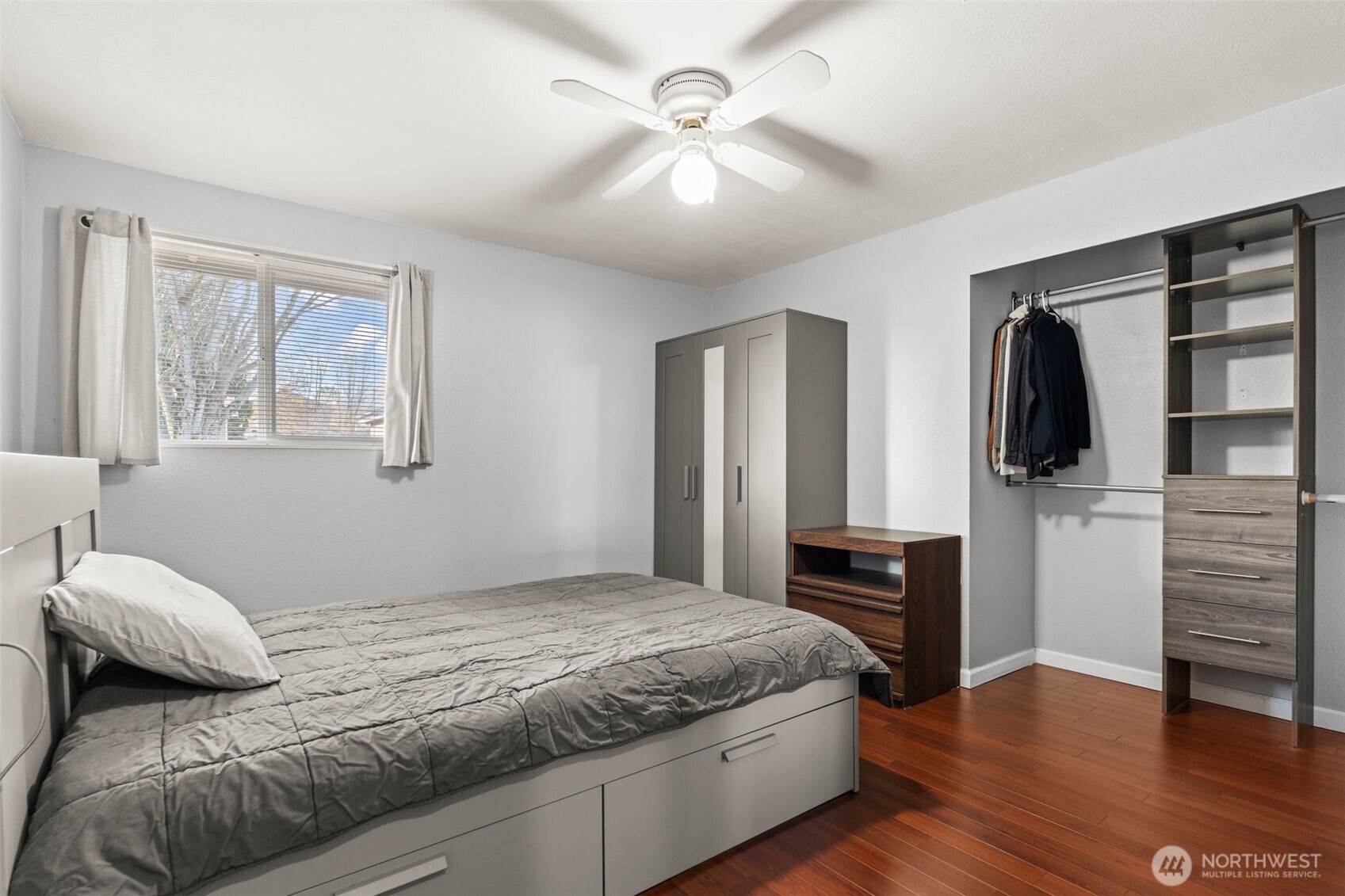 19234 121st Place Southeast Kent, WA 98031 - Photo 10 of 37 a bedroom with a bed and wooden floor