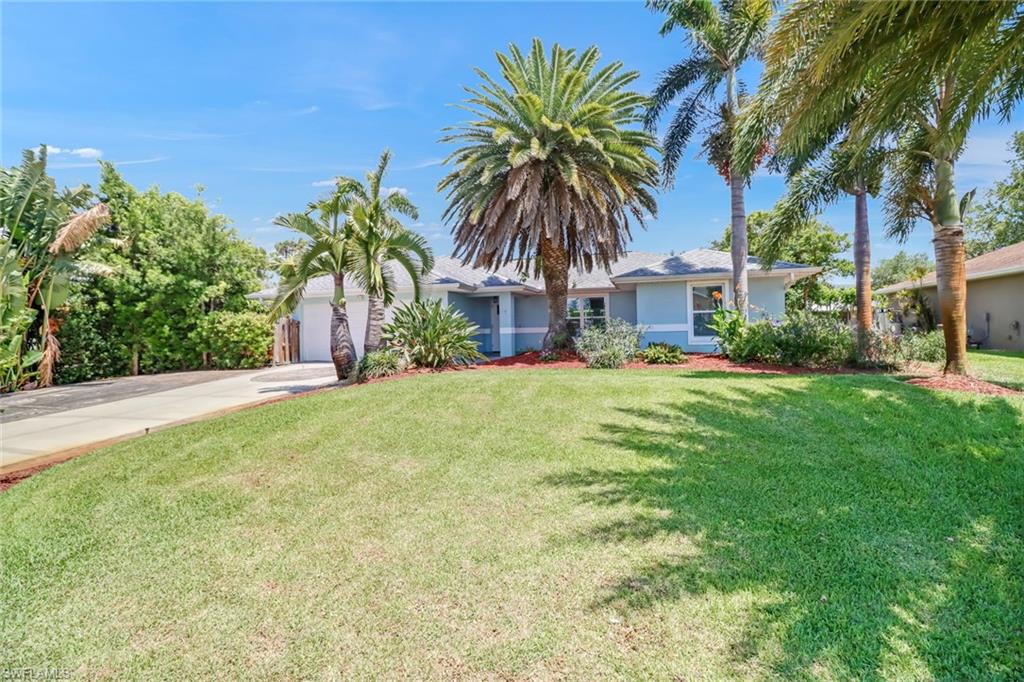 8116 Sandpiper Road Fort Myers, FL 33967 - Photo 1 of 29 View of front of home featuring a front lawn