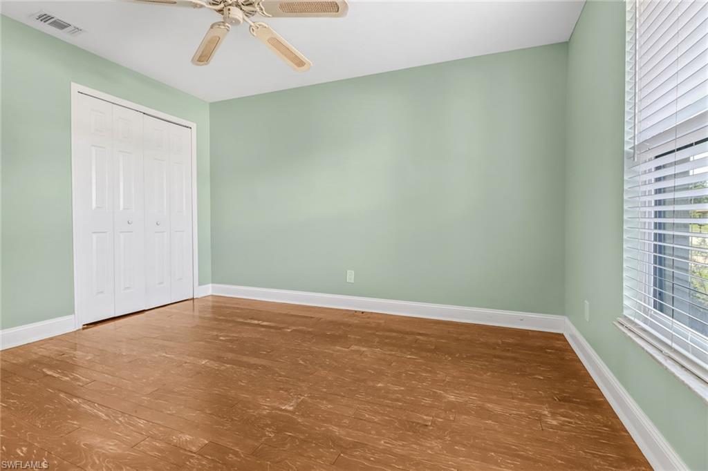 8116 Sandpiper Road Fort Myers, FL 33967 - Photo 18 of 29 Spare room featuring hardwood / wood-style floors and ceiling fan