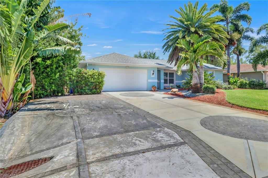 8116 Sandpiper Road Fort Myers, FL 33967 - Photo 2 of 29 View of front of property with a garage