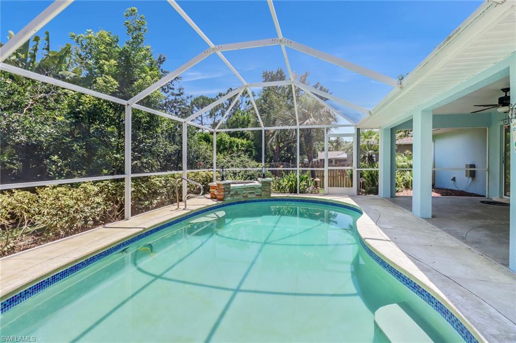 8116 Sandpiper Road Fort Myers, FL 33967 - Photo 25 of 29 View of swimming pool featuring a patio, a lanai, and ceiling fan
