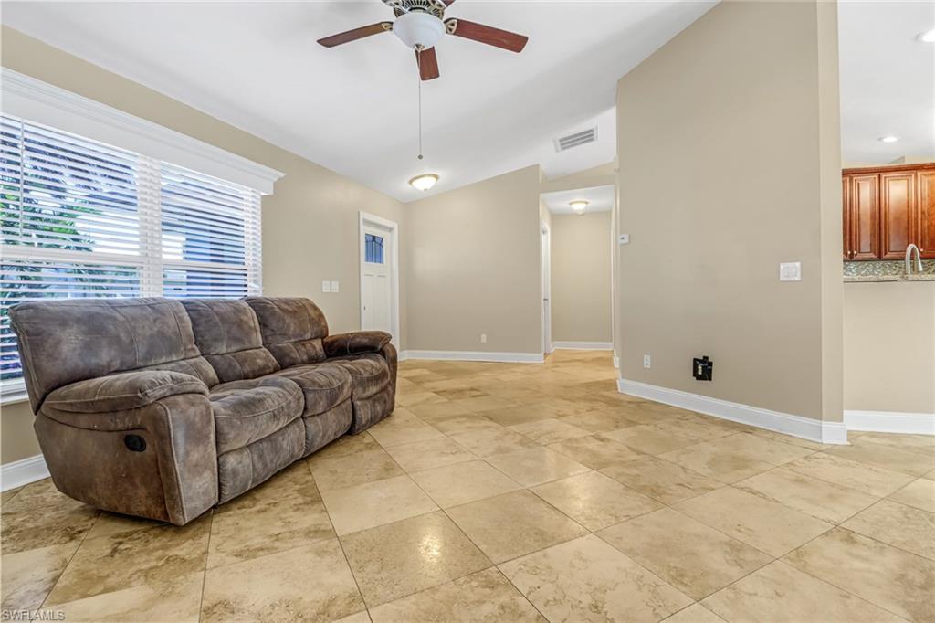 8116 Sandpiper Road Fort Myers, FL 33967 - Photo 5 of 29 Living room featuring ceiling fan and light tile floors