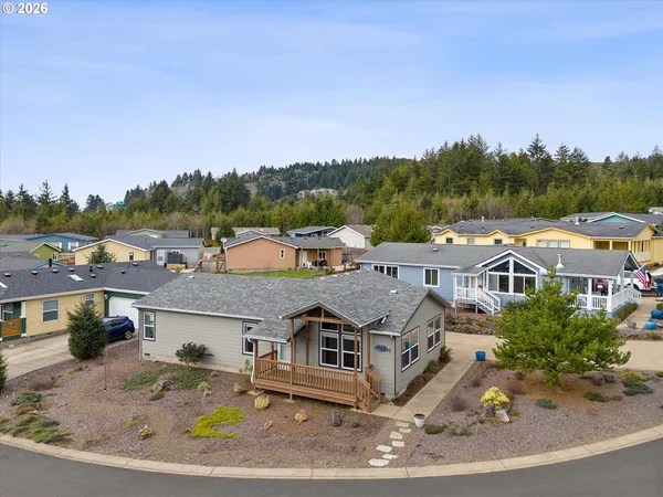 an aerial view of residential houses with outdoor space