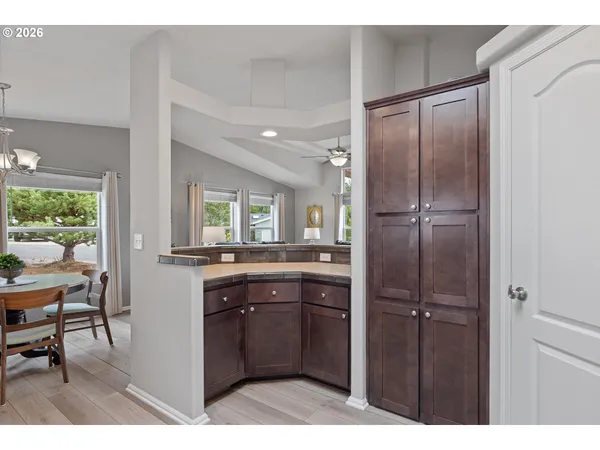 a view of room with wooden floor and windows