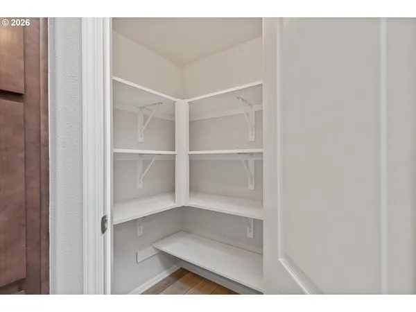 a bedroom with a bed and a ceiling fan