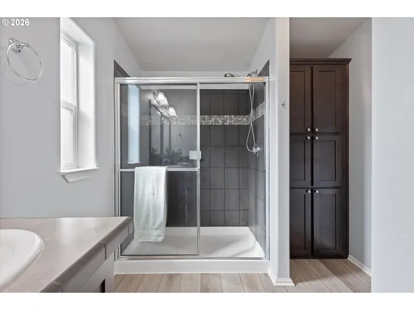a bathroom with a sink and a mirror with window