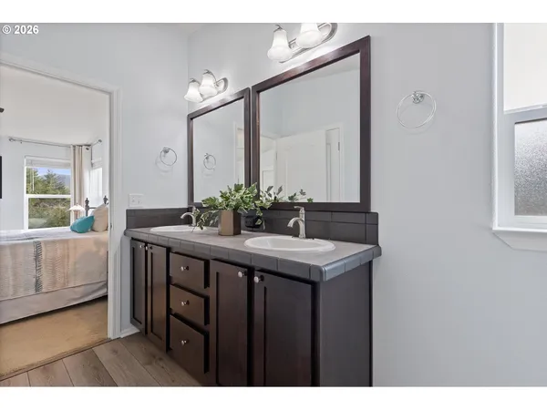 a bathroom with a shower and a bath tub