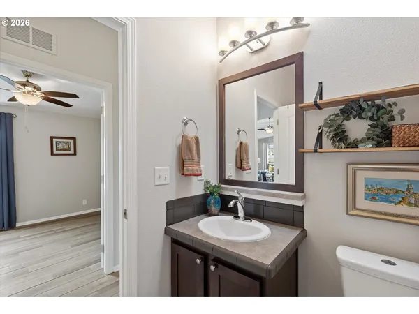 a backyard of a house with yard and sitting area