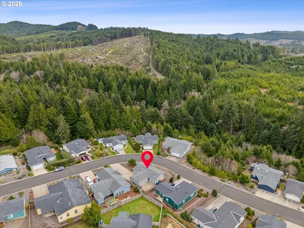 a view of a house with a yard street and a garage