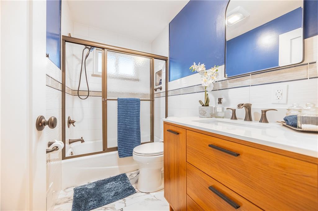 430 Amherst Avenue Coraopolis, PA 15108 - Photo 13 of 33 a spacious bathroom with a granite countertop sink toilet and shower