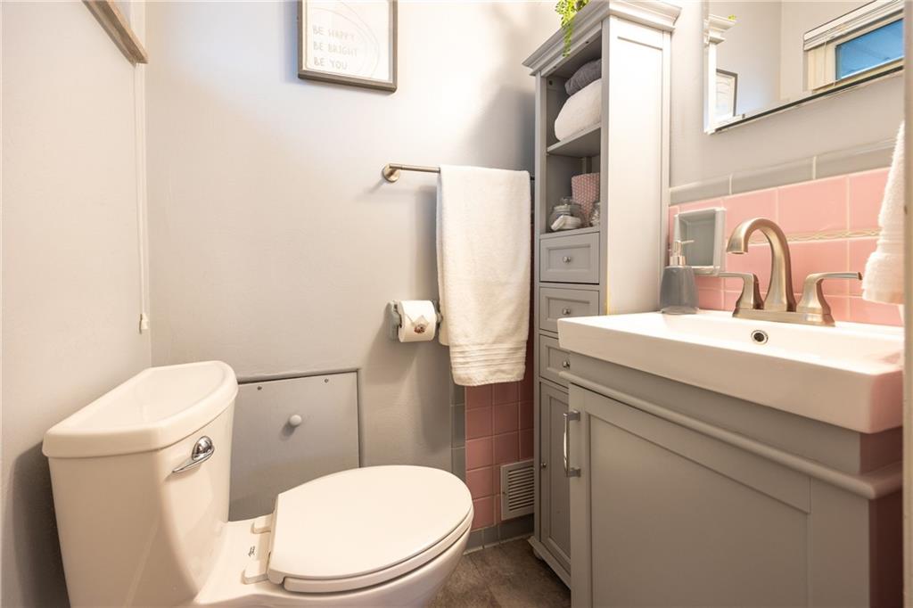 430 Amherst Avenue Coraopolis, PA 15108 - Photo 15 of 33 a bathroom with a sink a toilet and a mirror