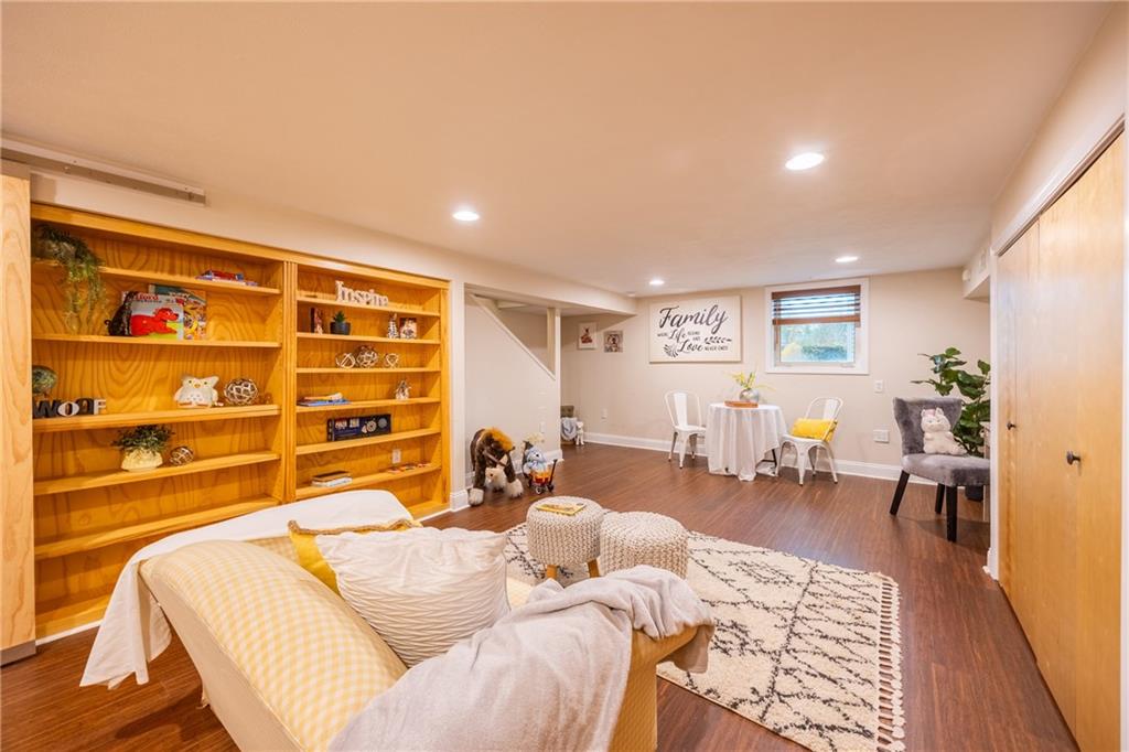 430 Amherst Avenue Coraopolis, PA 15108 - Photo 19 of 33 a living room with furniture a lamp and wooden floor
