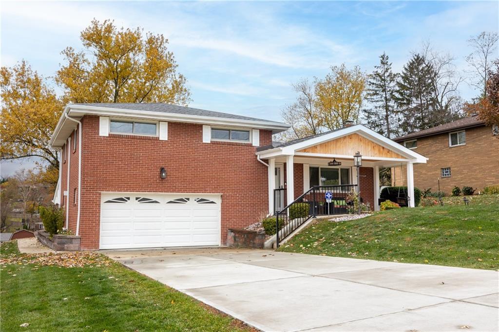 430 Amherst Avenue Coraopolis, PA 15108 - Photo 2 of 33 a front view of a house with a yard and garage