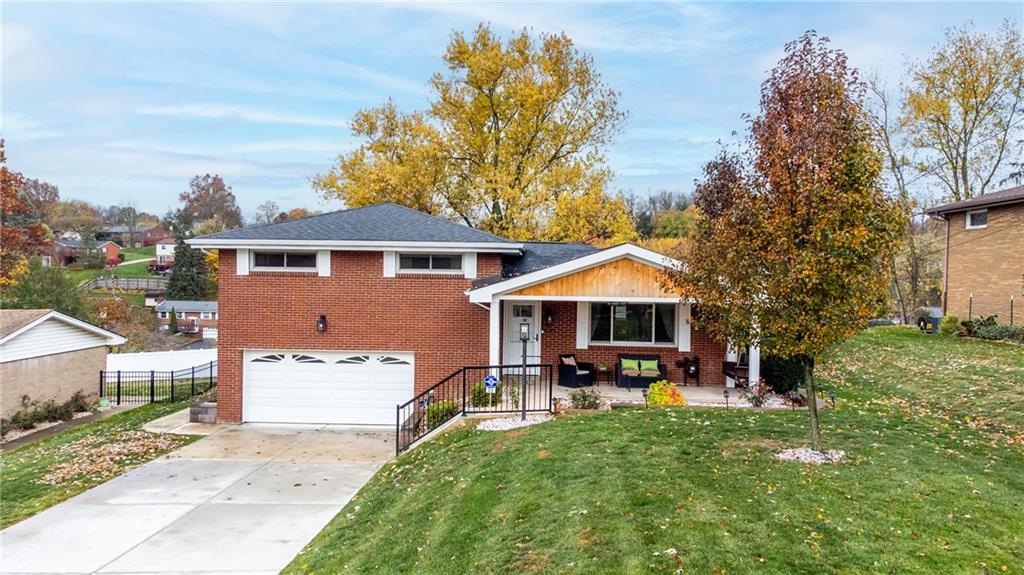 430 Amherst Avenue Coraopolis, PA 15108 - Photo 27 of 33 a front view of a house with a porch and a yard