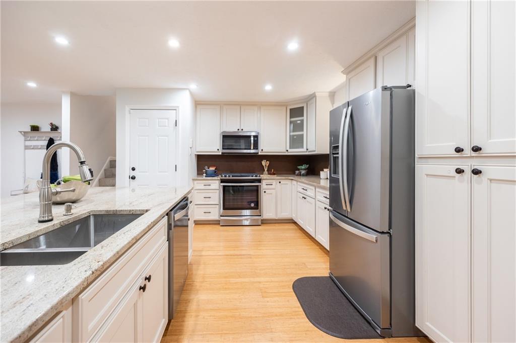 430 Amherst Avenue Coraopolis, PA 15108 - Photo 8 of 33 a kitchen with kitchen island granite countertop appliances cabinets and a sink