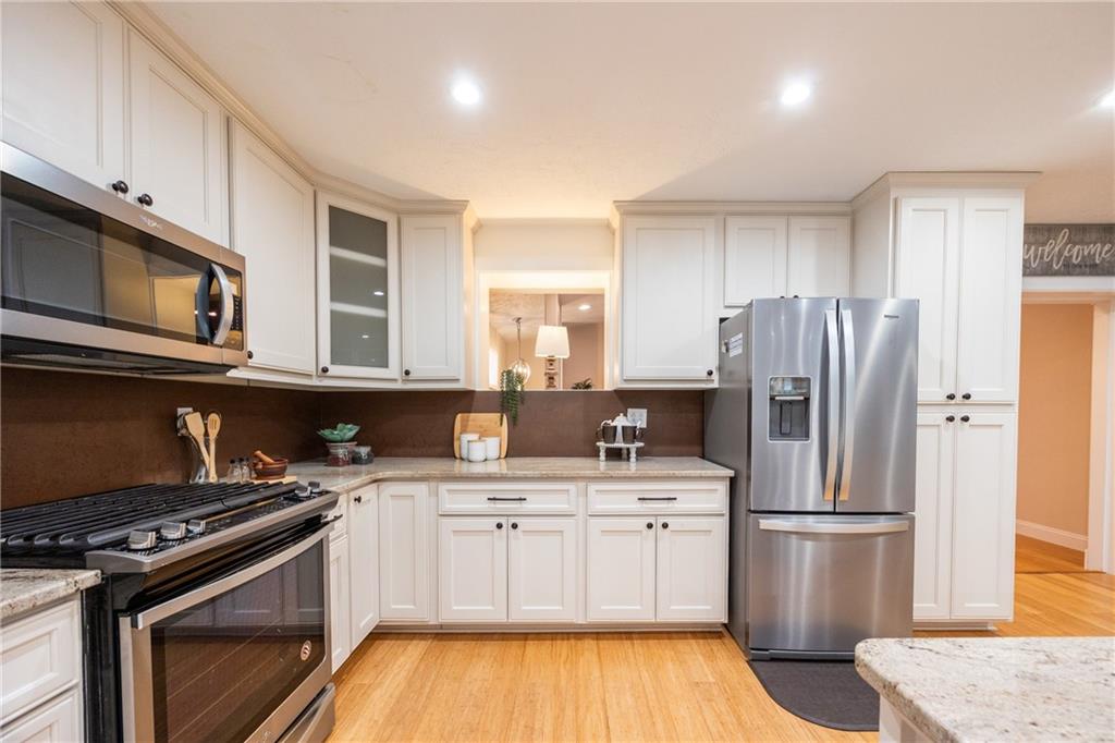 430 Amherst Avenue Coraopolis, PA 15108 - Photo 9 of 33 a kitchen with a stove sink and refrigerator