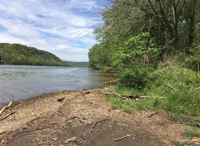 a view of a lake with mountain in the background