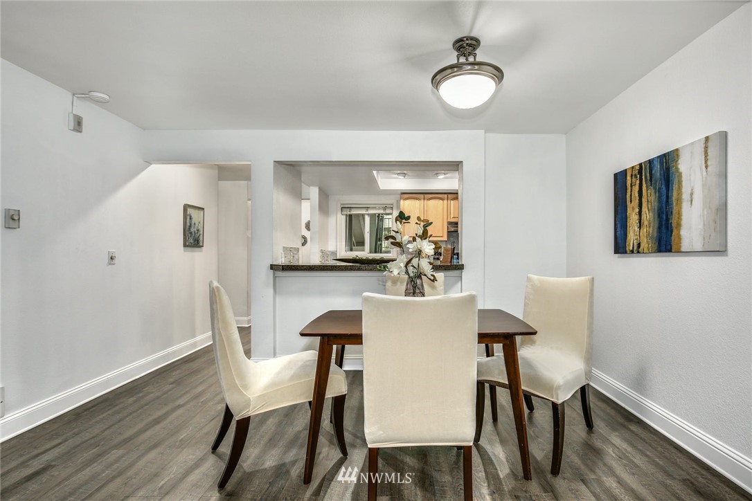 7571 Old Redmond Road, Unit 11 Redmond, WA 98052 - Photo 8 of 27 a view of a dining room with furniture and wooden floor