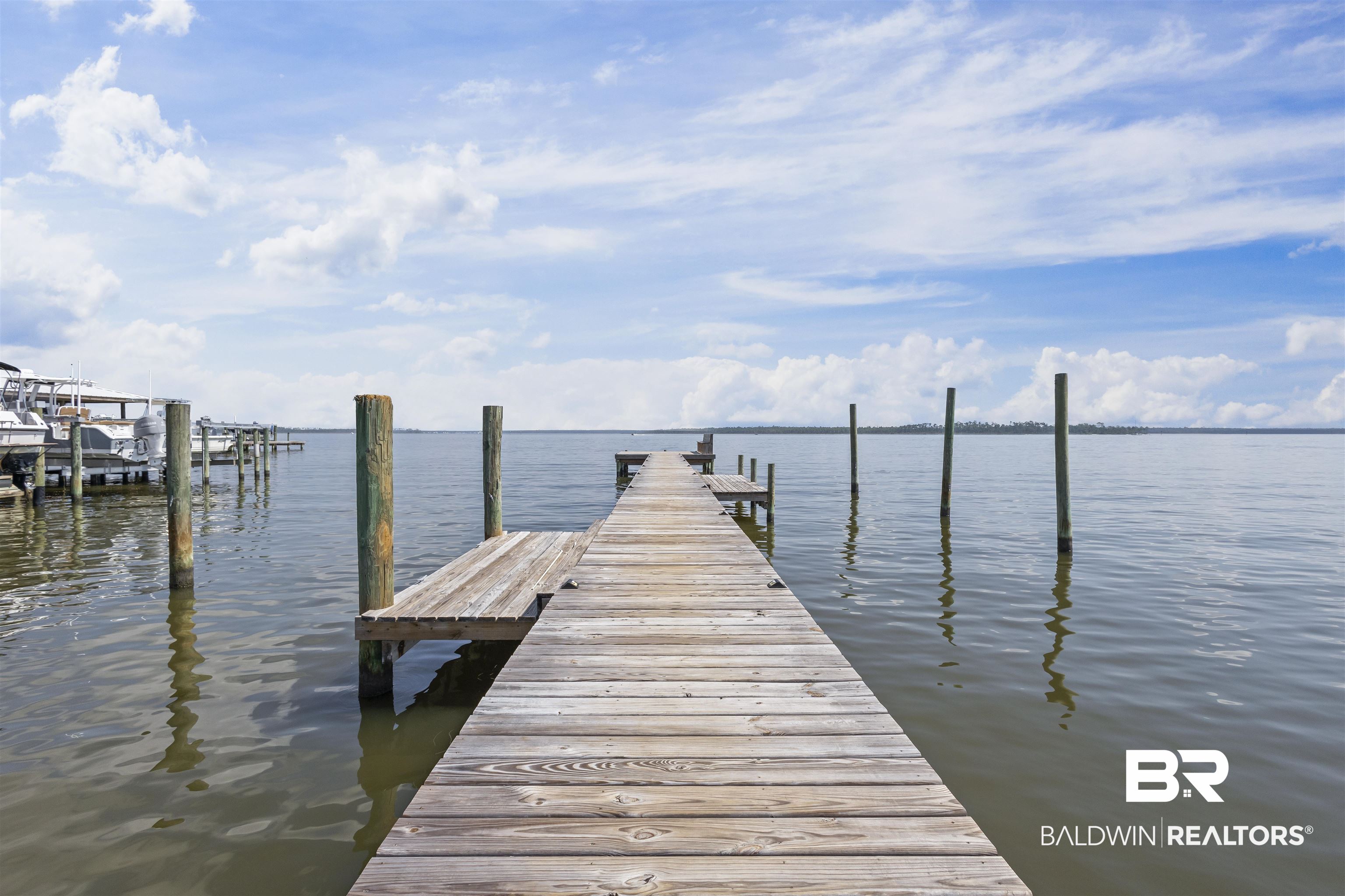 25925 Canal Road, Unit 207 Orange Beach, AL 36561 - Photo 34 of 42 View of dock featuring a water view