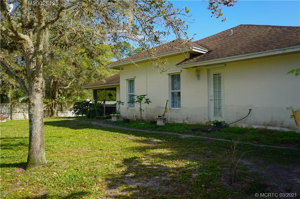 7302 Santa Rosa Parkway Fort Pierce, FL 34951 - Photo 11 of 33 a view of a house with backyard and garden