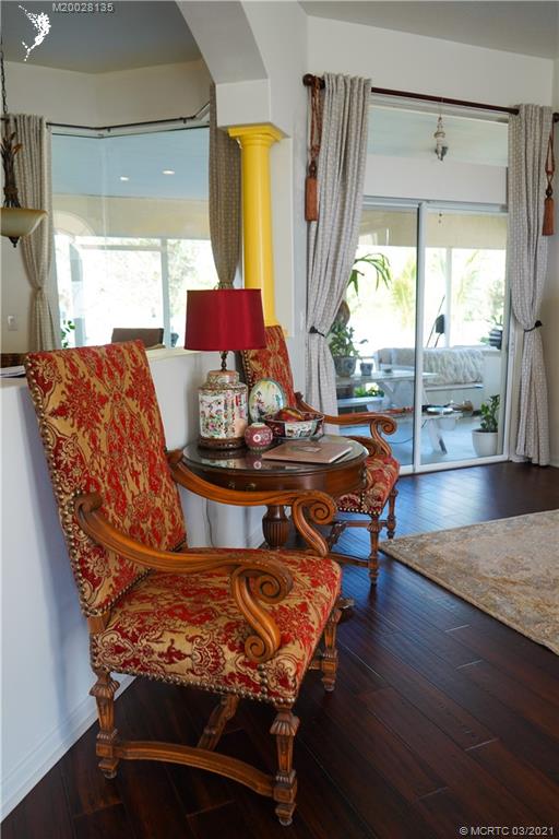 7302 Santa Rosa Parkway Fort Pierce, FL 34951 - Photo 18 of 33 a living room with furniture and a wooden floor
