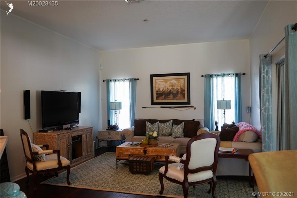 7302 Santa Rosa Parkway Fort Pierce, FL 34951 - Photo 23 of 33 a living room with furniture and a flat screen tv