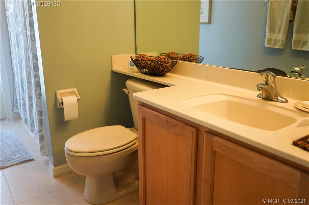 7302 Santa Rosa Parkway Fort Pierce, FL 34951 - Photo 24 of 33 a bathroom with a sink and a toilet